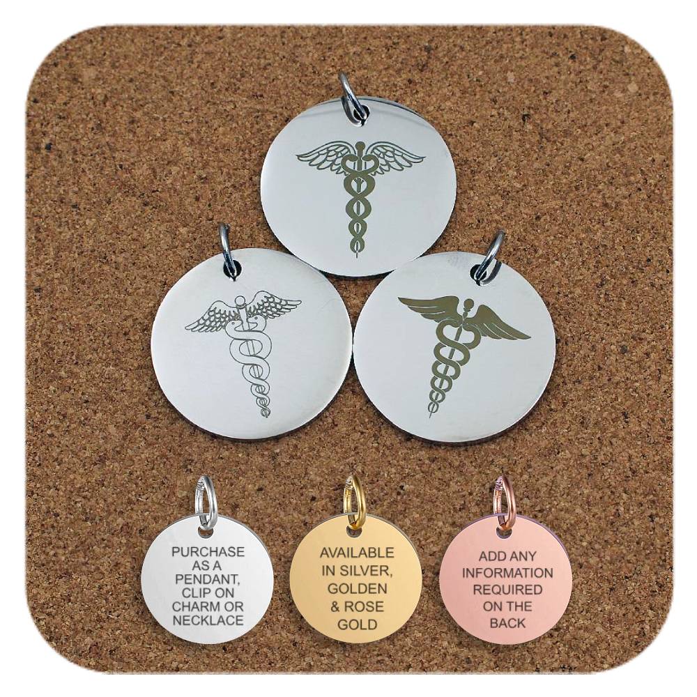 Three round medical alert pendants with different caduceus symbol designs displayed on a corkboard. Below them are three smaller pendants in silver, gold, and rose gold colors. The silver pendant reads 'Purchase as a pendant, clip on charm or necklace'; the gold pendant reads 'Available in silver, golden & rose gold'; and the rose gold pendant reads 'Add any information required on the back'.