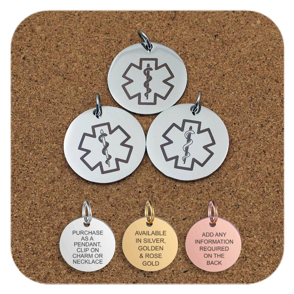 Three round medical alert pendants featuring the Star of Life symbol with a Rod of Asclepius, displayed on a corkboard. Below them are three smaller pendants in silver, gold, and rose gold finishes. The silver pendant reads 'Purchase as a pendant, clip on charm or necklace'; the gold pendant reads 'Available in silver, golden & rose gold'; and the rose gold pendant reads 'Add any information required on the back'.