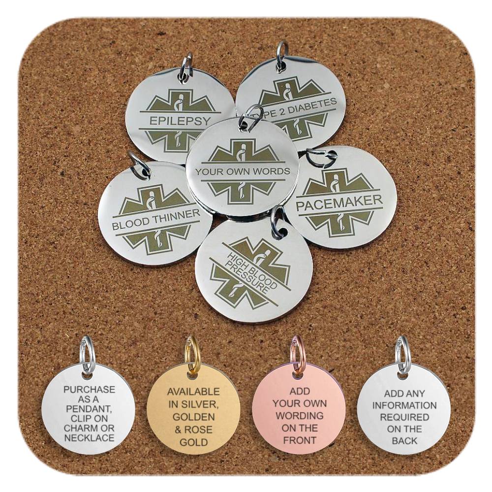 Set of six round medical ID pendants with engraved medical symbols and text including 'Epilepsy', 'Type 2 Diabetes', 'Blood Thinner', 'Pacemaker', 'High Blood Pressure', and 'Your Own Words' for custom engraving, displayed on a corkboard. Four additional pendants at the bottom show engraved text that reads: pendant or charm use, finishes in silver, gold, and rose gold, custom wording on the front, and space for additional information on the back.