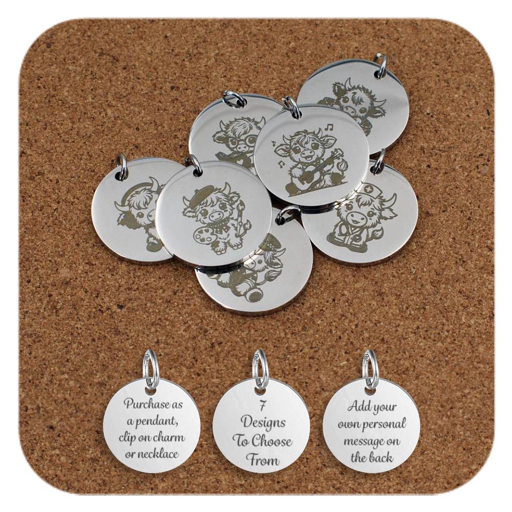 Set of round silver metal pendants engraved with various cute cartoon Highland cow designs, displayed on a cork board. Each pendant shows a different themed cow character, including cows with glasses, musical notes, a painter's palette, and other playful details. Below the pendants are three discs engraved with text: 'Purchase as a pendant, clip on charm or necklace,' '7 Designs To Choose From,' and 'Add your own personal message on the back'