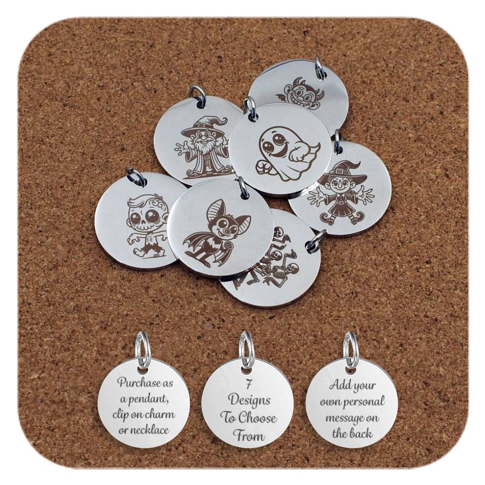 Set of 7 engraved stainless steel Halloween-themed pendants displayed on a corkboard. Designs include a ghost, bat, wizard, witch, zombie, skeleton, and devil character. Bottom row shows three sample backs with text: "Purchase as a pendant, clip on charm or necklace", "7 Designs To Choose From", and "Add your own personal message on the back".