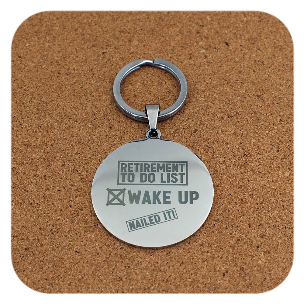 Silver keyring with Retirement To Do List design on cork background