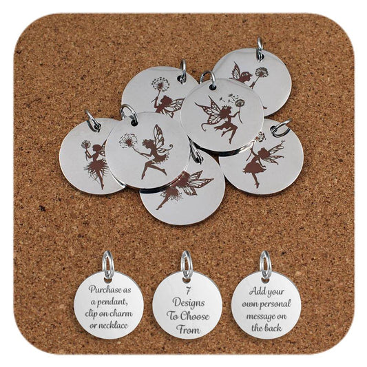 Stainless steel pendants engraved with whimsical fairy designs, each featuring a winged figure holding a dandelion, arranged on a cork background. Below the pendants are three additional discs showing engraved text that reads: 'Purchase as a pendant, clip on charm or necklace,' '7 Designs To Choose From,' and 'Add your own personal message on the back'