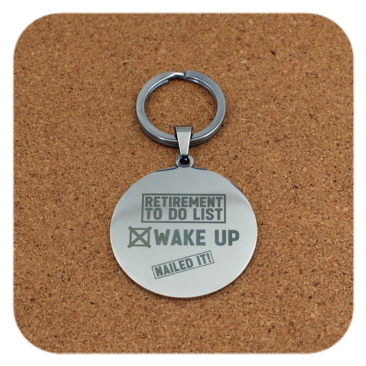 Silver keyring with Retirement To Do List design on cork background