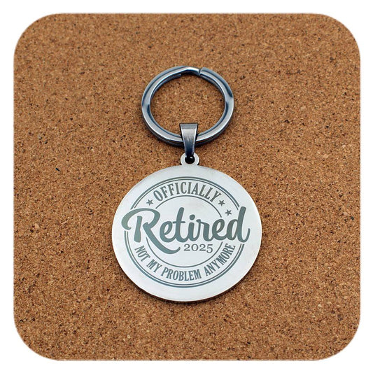 Silver keyring with Retired 2025 Not My Problem Anymore design on cork background
