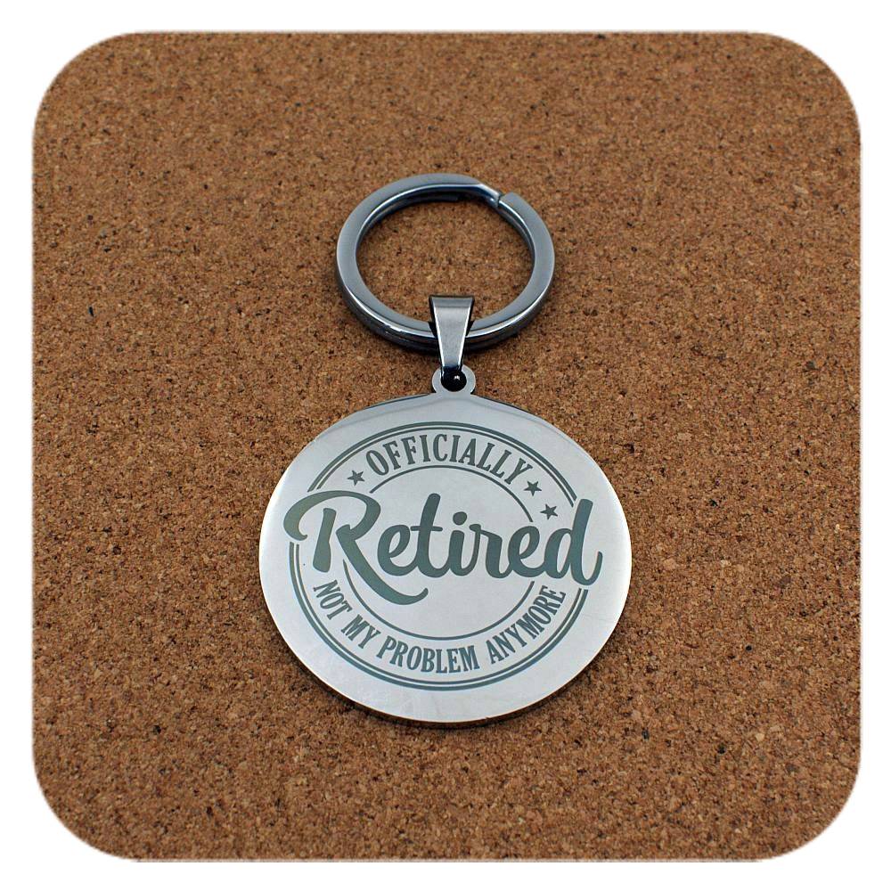 Silver keyring with Retired Not My Problem Anymore design on cork background