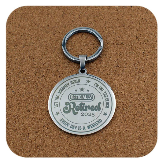 Silver keyring with Retired 2025 Every Day Is A Weekend design on cork background