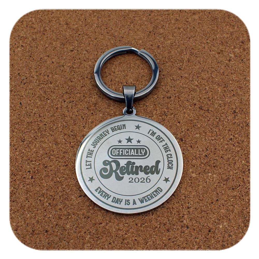 Silver keyring with Retired 2026 Every Day Is A Weekend design on cork background