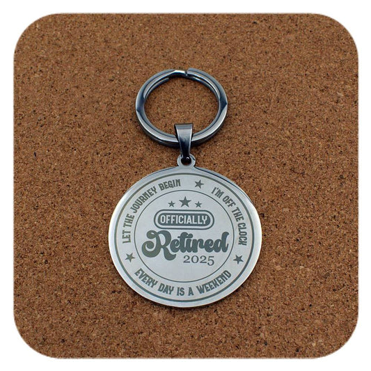 Silver keyring with Retired 2025 Every Day Is A Weekend design on cork background