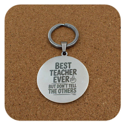 Silver keyring with Best Teacher Don't Tell Others design on cork background