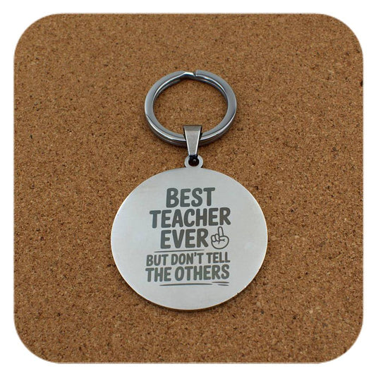 Silver keyring with Best Teacher Don't Tell Others design on cork background