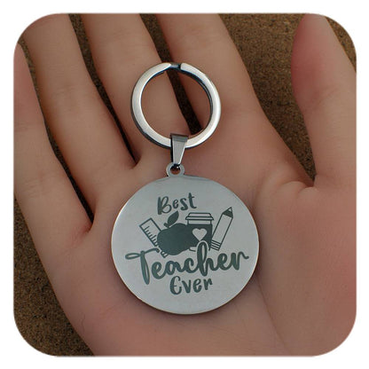 Silver keyring with Best Teacher Ever design held in a hand