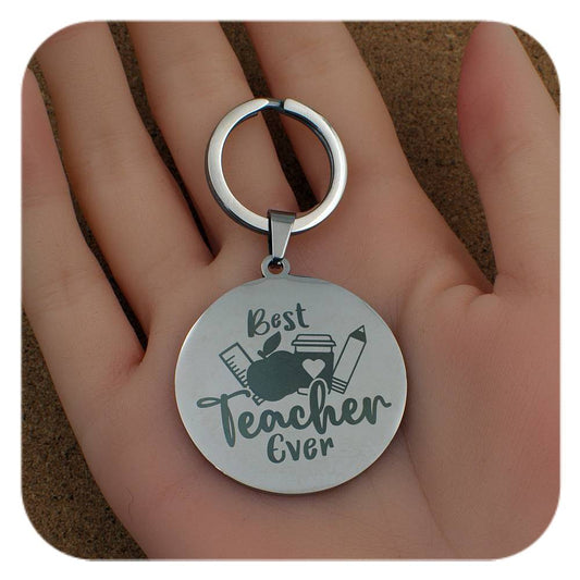 Silver keyring with Best Teacher Ever design held in a hand