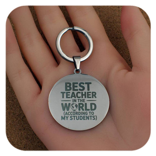 Silver keyring with Best Teacher In The World design held in a hand