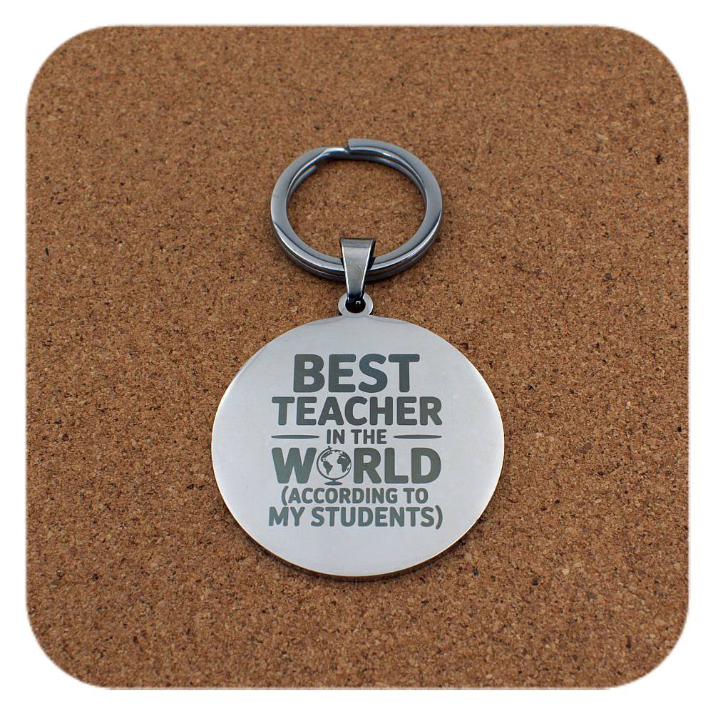 Silver keyring with Best Teacher In The World design on cork background