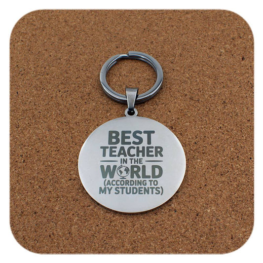 Silver keyring with Best Teacher In The World design on cork background