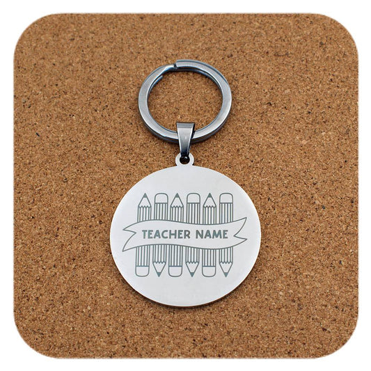 Silver keyring with Crayons With Teachers Name design on cork background