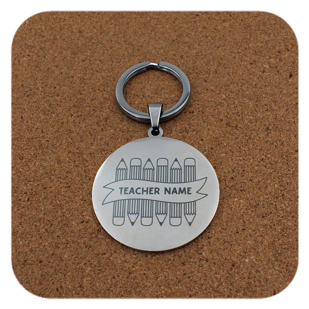 Silver keyring with Crayons With Teachers Name design on cork background