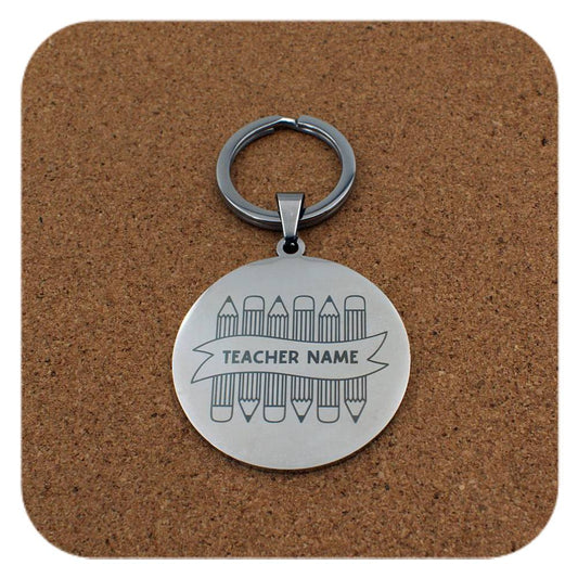 Silver keyring with Crayons With Teachers Name design on cork background