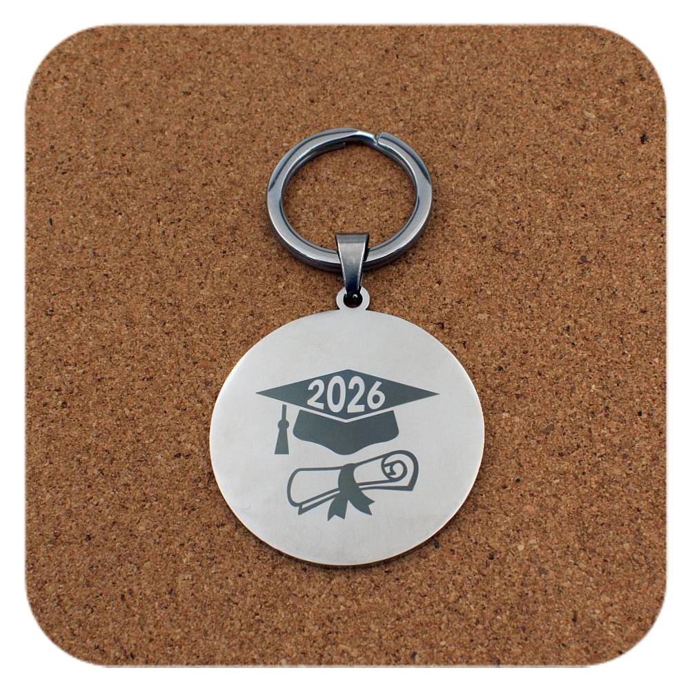 Silver keyring with Graduation Cap Diploma 2026 design on cork background
