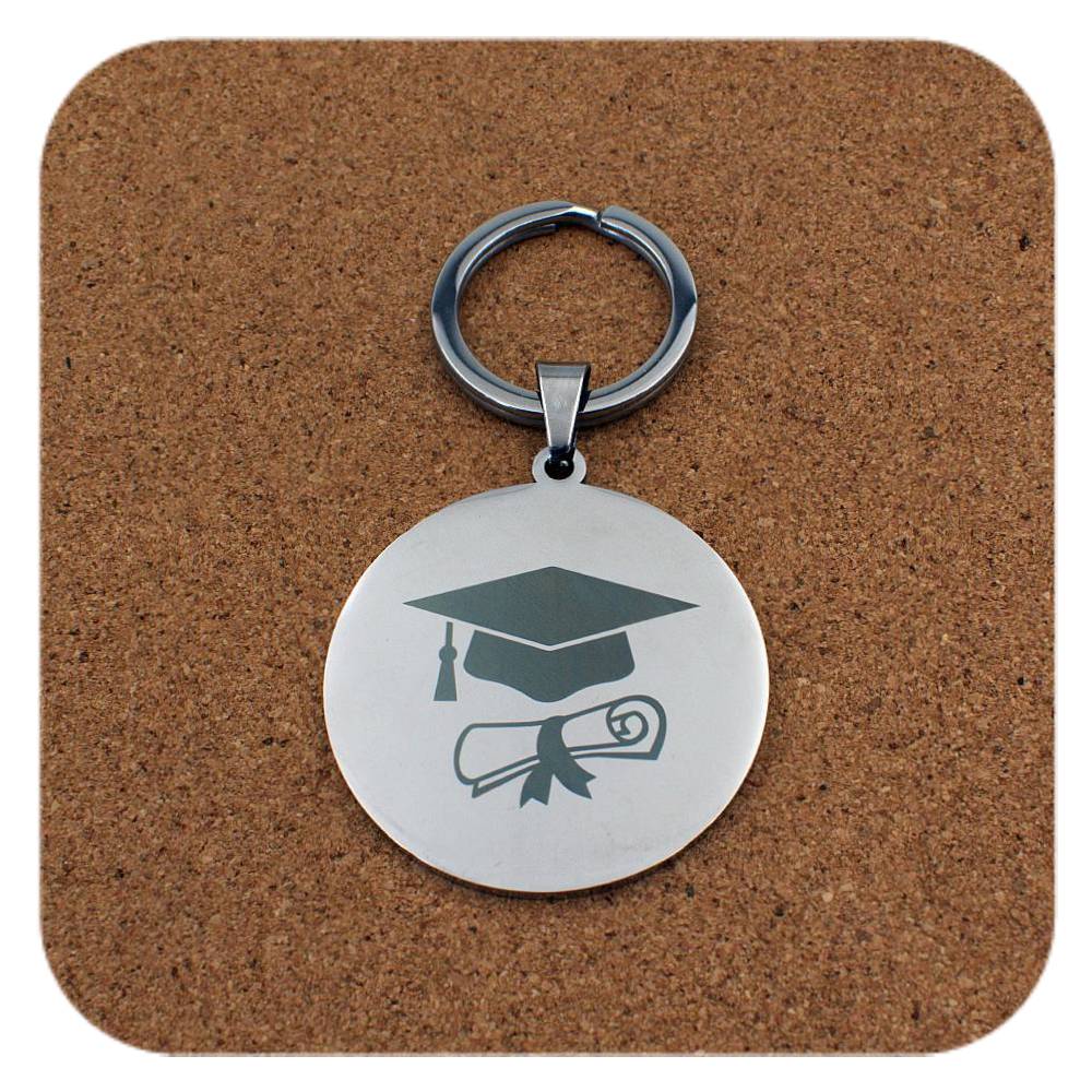 Silver keyring with Graduation Cap Diploma design on cork background