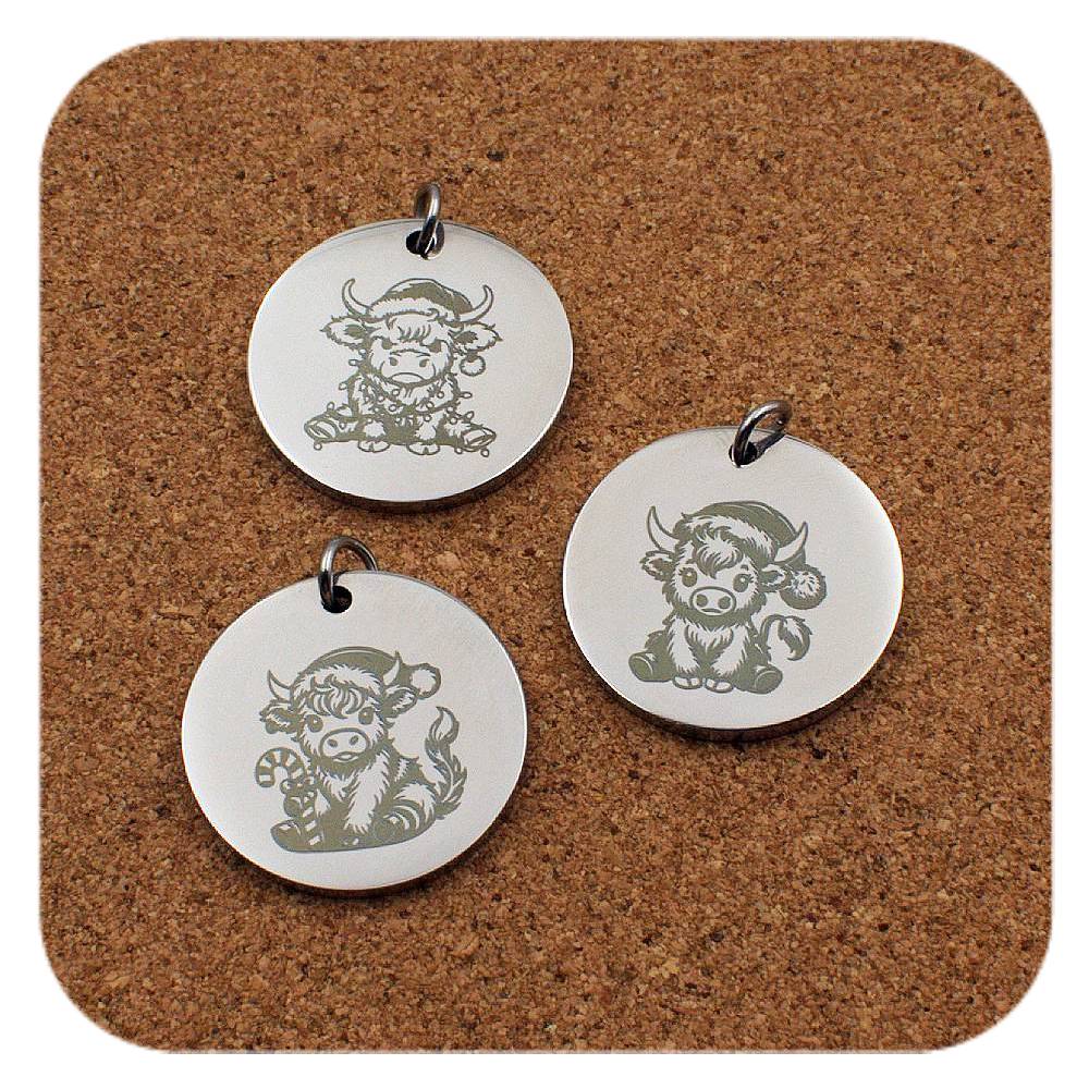 Engraved Highland Cow stainless steel pendant in three designs: Christmas lights, Christmas hat and candy cane