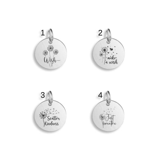 Silver pendants with different Uplifting Dandelion designs on a white background