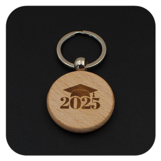 Wooden keyring with Graduation Cap 2025 design on black background