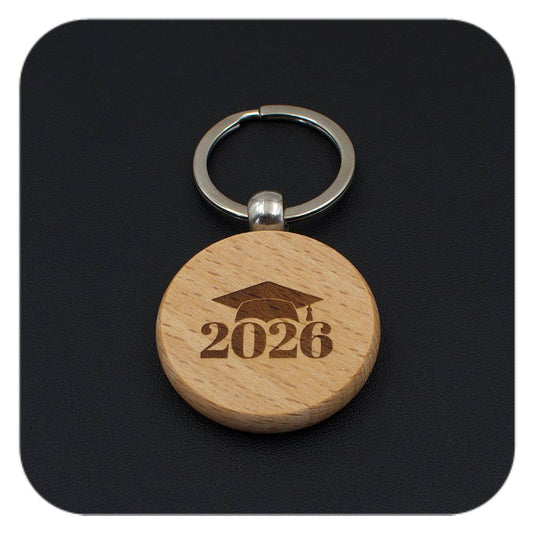 Wooden keyring with Graduation Cap 2026 design on black background