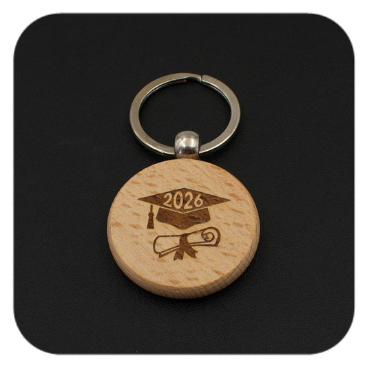 Wooden keyring with Graduation Cap Diploma 2026 design on black background