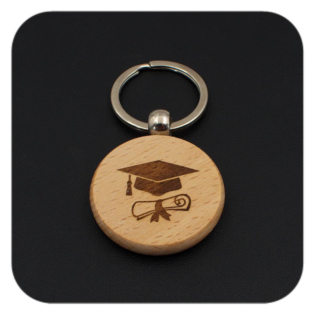 Wooden keyring with Graduation Cap Diploma design on black background