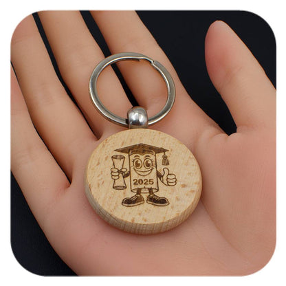 Wooden keyring with Novelty Graduation Diploma 2025 design held in a hand