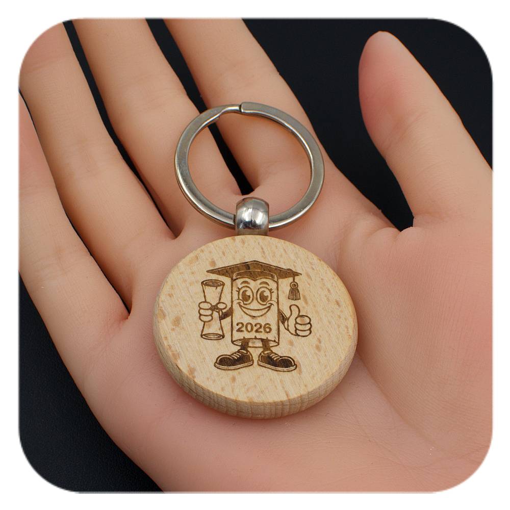 Wooden keyring with Novelty Graduation Diploma 2026 design held in a hand