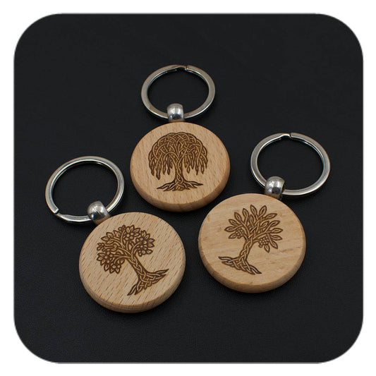 Wooden keyrings with different Celtic Tree Zodiac designs on black background