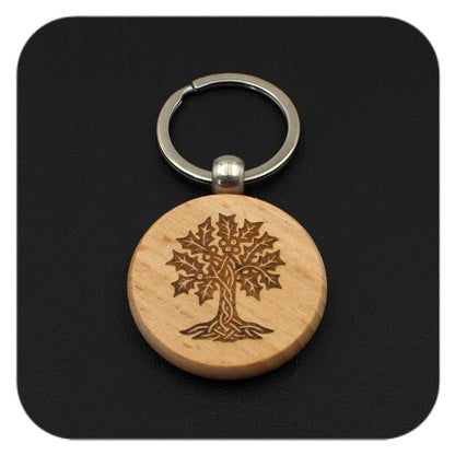 Wooden keyring with Holly Celtic Tree Zodiac design on black background
